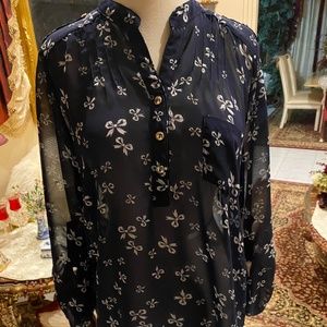 Navy and with white bows printed on shear fabric. Size M juniors